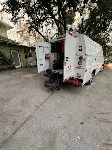 Magnet Plumbing service vehicle on-site for Grease Trap Cleaning in Brickell Business District